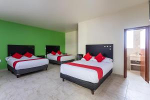 Postel nebo postele na pokoji v ubytování Capital O Hotel Emperadores Inn, Atlixco
