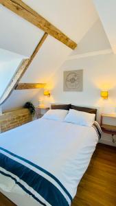 Postel nebo postele na pokoji v ubytování L'Hirondelle