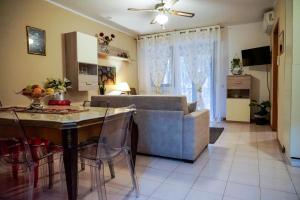 a living room with a couch and a table at House 416 Sweet Apartment in Perugia
