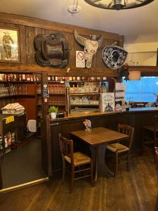 a restaurant with a table and chairs and a counter at Agriturismo al Ranch in Castello dʼAviano +77 photos