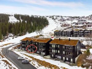 an apartment building with a red circle on the roof at Apartment Øvre Tråstølen - Voss in Vossevangen