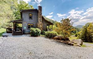a mountain home with a stone driveway at Grandpa John Cabin - Hot Tub, Game Room in Sugar Grove