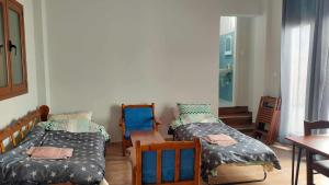 Posteľ alebo postele v izbe v ubytovaní Kalamata home, Marina C
