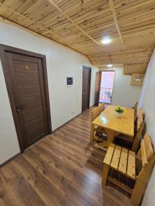 a dining room with a wooden table and chairs at NUR TOON in Areni +28 photos