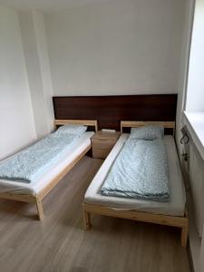 Postel nebo postele na pokoji v ubytování Penzion Iris
