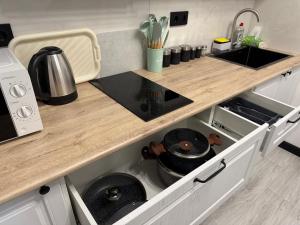 A kitchen or kitchenette at Memory Apart Hotel