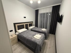 A bed or beds in a room at Memory Apart Hotel