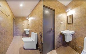 a bathroom with a toilet and a sink at Super Townhouse OAK YMCA Ground in Chennai