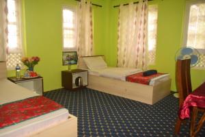 Ένα ή περισσότερα κρεβάτια σε δωμάτιο στο Kathmandu Family Home