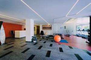 an office with an orange ball in the middle of a room at Vernescu 4 Luxury Living - Terrace Central Chic in Bucharest