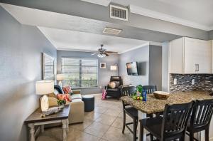 a kitchen and living room with a table and chairs at Tropical Beach Resorts - Sarasota in Sarasota