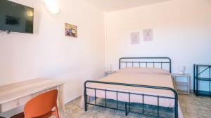 Ένα ή περισσότερα κρεβάτια σε δωμάτιο στο Agriturismo Tenuta Arbanoa