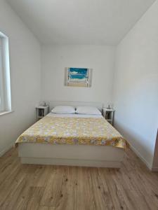Ein Bett oder Betten in einem Zimmer der Unterkunft Apartments Miljas