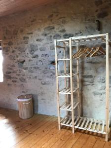 a wooden bunk bed in a room with a wall at Charmante petite maison in Aouste-sur-Sye