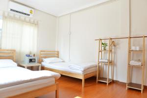 Postel nebo postele na pokoji v ubytování PanPan Hostel + 21 fotografií