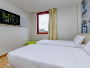 Postel nebo postele na pokoji v ubytování B&B Hotel Verona
