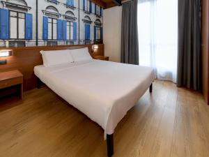 Postel nebo postele na pokoji v ubytování B&B Hotel Verona
