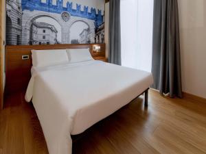 Postel nebo postele na pokoji v ubytování B&B Hotel Verona