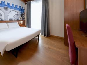 Postel nebo postele na pokoji v ubytování B&B Hotel Verona