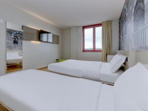 Postel nebo postele na pokoji v ubytování B&B Hotel Verona