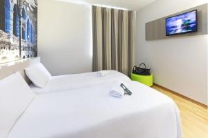 Postel nebo postele na pokoji v ubytování B&B Hotel Verona