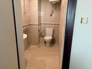 a bathroom with a toilet and a sink at Miramar palace 615S in Sunny Beach
