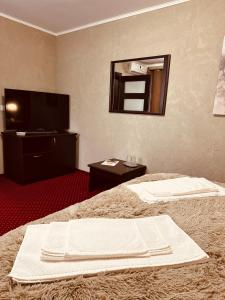 Voodi või voodid majutusasutuse Nowad Hotel toas
