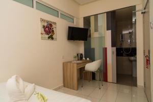 Televiisor ja/või meelelahutuskeskus majutusasutuses Hotel 138 @ Subang