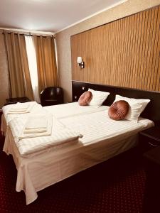 Voodi või voodid majutusasutuse Nowad Hotel toas