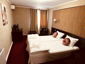 Voodi või voodid majutusasutuse Nowad Hotel toas