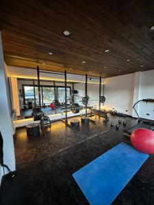a gym with several treadmills and exercise equipment at De los rios casa con pileta in San Carlos de Bariloche
