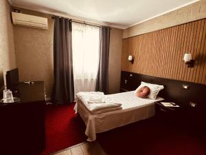 Voodi või voodid majutusasutuse Nowad Hotel toas