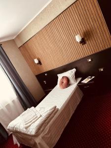 Voodi või voodid majutusasutuse Nowad Hotel toas