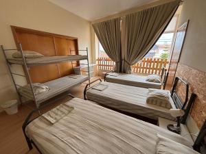 Postel nebo postele na pokoji v ubytování Garden Hostel