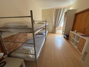 Postel nebo postele na pokoji v ubytování Garden Hostel