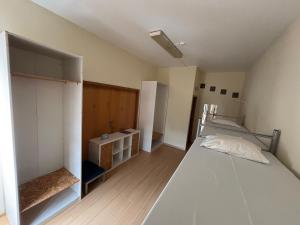 Postel nebo postele na pokoji v ubytování Garden Hostel