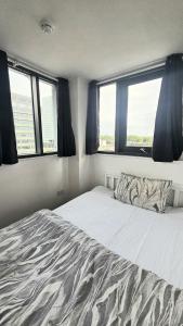 Postel nebo postele na pokoji v ubytování City South + 2 fotografie