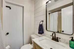 a bathroom with a sink and a mirror at Hike, Fish and Explore Lakefront Cottage in Baldwin in Baldwin +22 photos