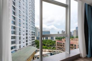 Nespecifikovaný výhled na destinaci Kanton nebo výhled na město při pohledu z aparthotelu