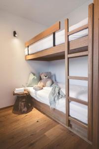 Łóżko lub łóżka w pokoju w obiekcie Ferienwelt Kesselgrub Hotel in Altenmarkt-Zauchensee