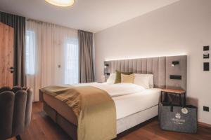 Łóżko lub łóżka w pokoju w obiekcie Ferienwelt Kesselgrub Hotel in Altenmarkt-Zauchensee