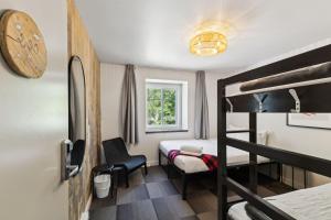 a room with a bed and a bunk bed at Auberge Manitonga in Mont-Tremblant +94 photos