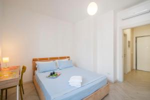 Postel nebo postele na pokoji v ubytování Pirelli Comfort Suite Battaglia Appartamenti + 11 fotografií