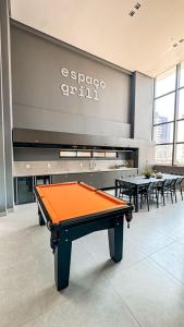 a pool table in a room with a piano at Studio306 - Simple 350 in João Pessoa