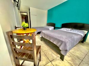 Postel nebo postele na pokoji v ubytování The King Frog Beach Hostal + 12 fotografií