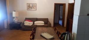 a living room with a couch and a table at Agriturismo San Vettore in Gambassi Terme +53 photos