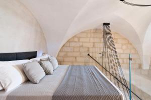 a bedroom with a bed with a hanging net at Battisti Home - Lecce Selection in Lecce