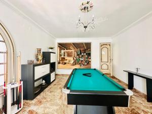 a living room with a pool table in it at Global Immo 8010 Montclar in Roses