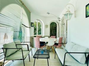 a living room with a table and chairs at Global Immo 8010 Montclar in Roses