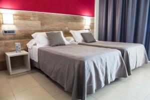 Postel nebo postele na pokoji v ubytování Hotel Joya